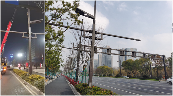الصين أعمدة الإنارة المصممة حسب الطلب عمود إنارة الشوارع الفولاذية بأذرع لتركيب الكاميرا المزود
